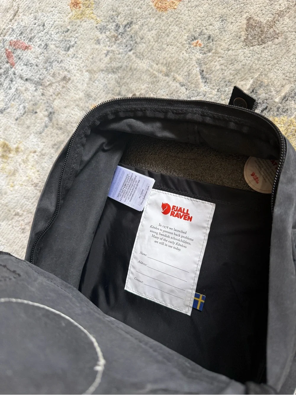Fjallraven Kanken Mini Backpack in Black with Red Logo